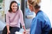 Female Patient And Rad Tech Have Consultation In Hospital Room