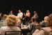 Audience listening to a panel of speakers