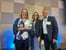 Tammy Elliot accepting award from Tana Phelps and Brian Bradfield