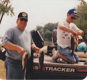 Jerry Glenn and Bill Herren showing off their catches after a fishing trip