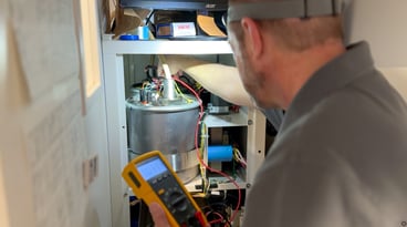 Man servicing imaging equipment