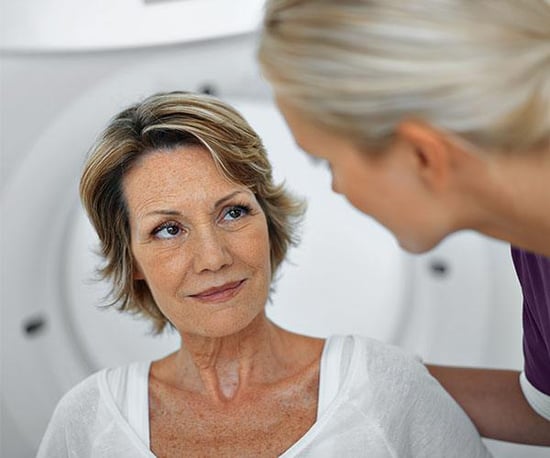 Radiologist tech talking to patient