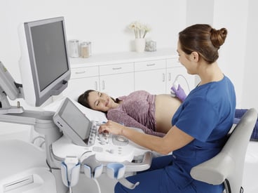 Healthcare worker performing ultrasound exam
