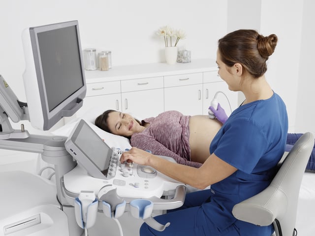 Healthcare worker performing ultrasound exam