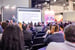 audience listening to presentation at a trade show