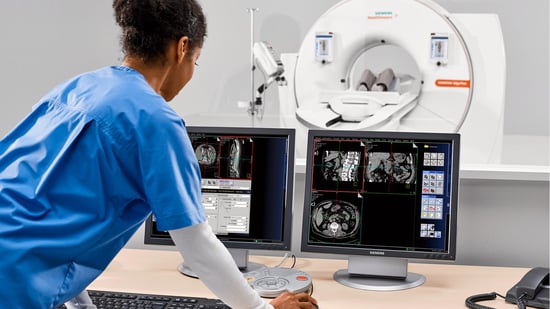 Tech assessing patient images 