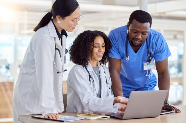 Healthcare workers looking at computer