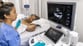 Sonographer performing an echocardiogram on a patient