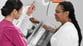 Woman receiving mammogram