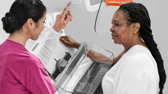 Woman receiving mammogram