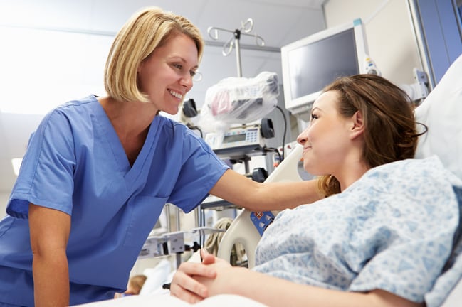 Nurse Comforting Patient in Hospital Room 1