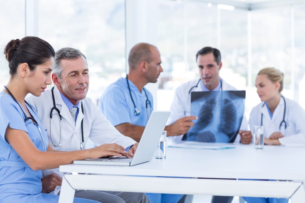 Healthcare professionals viewing an X-ray